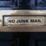 letter box in a door, no junk mail sign